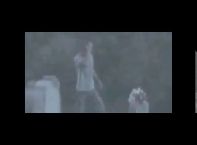  Ghostly Figure Appears by Mourner at Graveyard in Haunting Video